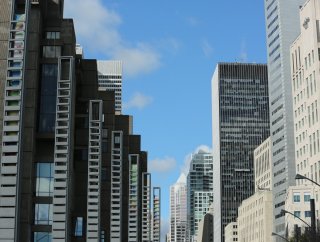 High-rise office buildings line a street in corporate America.